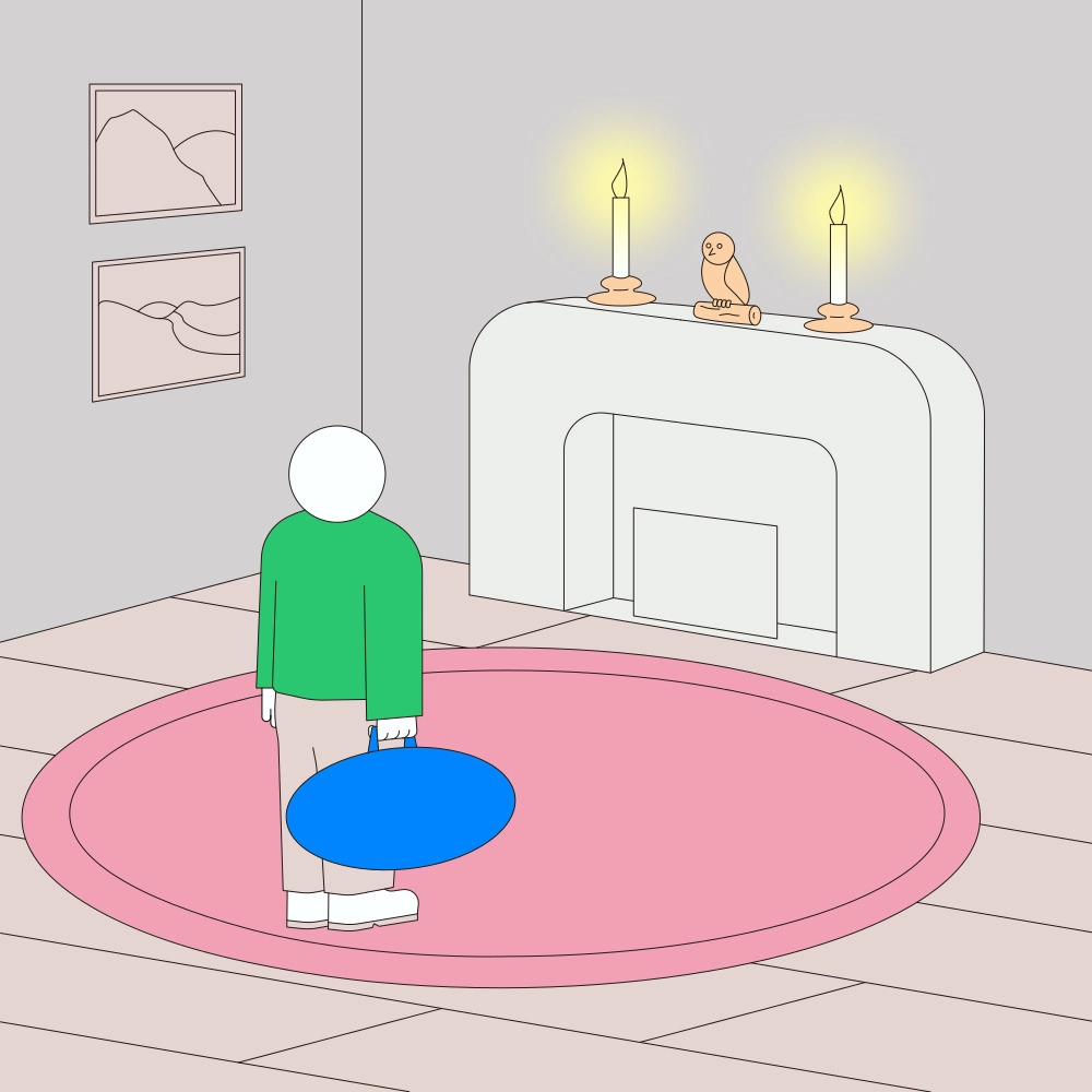 First panel of a comic by Jhon Boy. A person in a green sweater stands in a minimalistic room with a pink circular rug and a white fireplace adorned with candles and a small bird sculpture. The person is holding a large blue bag, gazing at the fireplace.